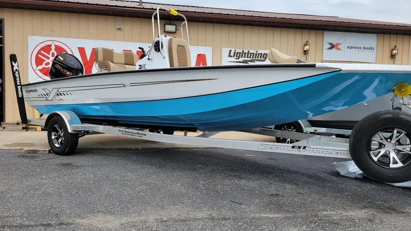 Slide: The Image of 2025 Xpress H20 Bay boat with Yamaha Vmax 115 SHO engine on trailer. - 9