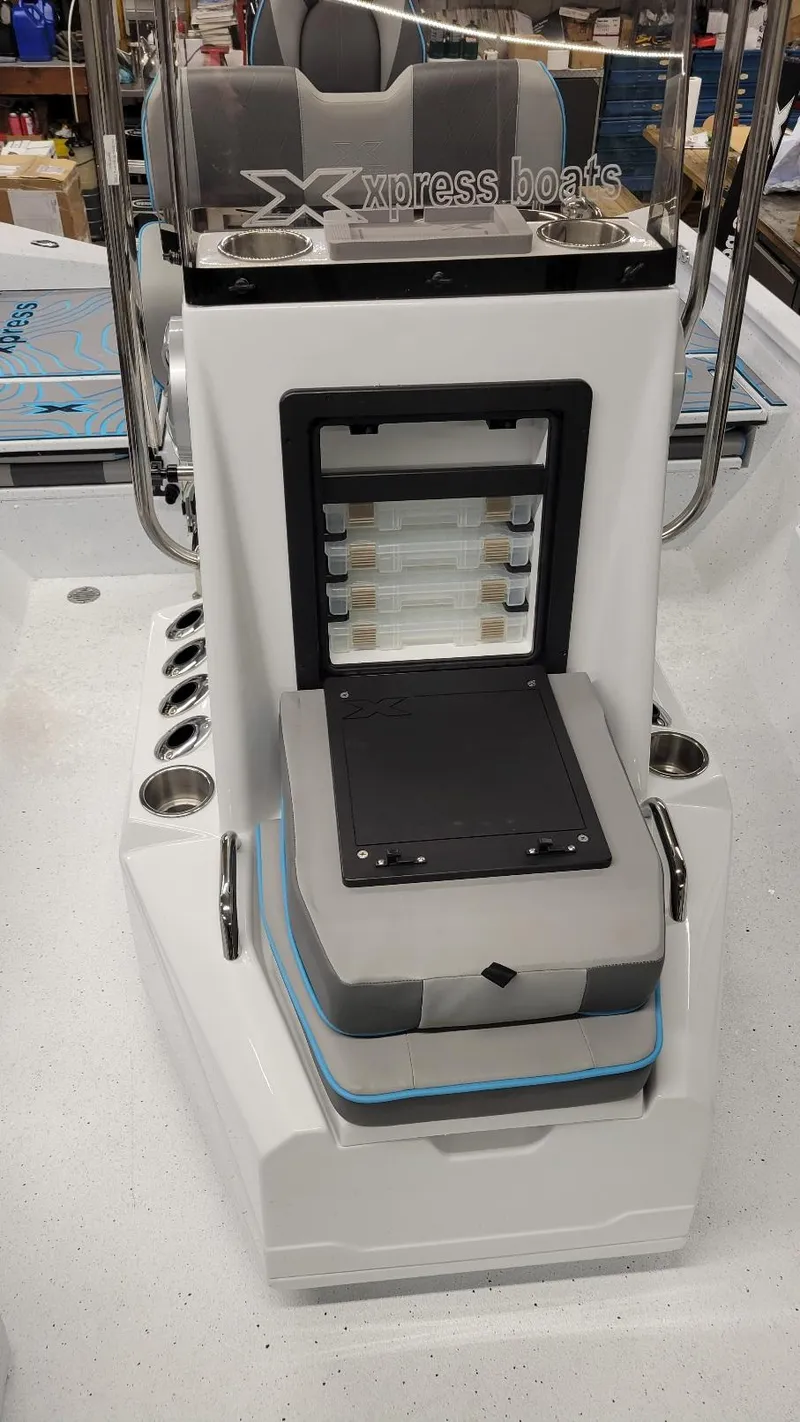 Slide: The Image of 2025 Xpress H20 Bay boat console with storage and seating, featuring Yamaha Vmax 150 SHO. - 10