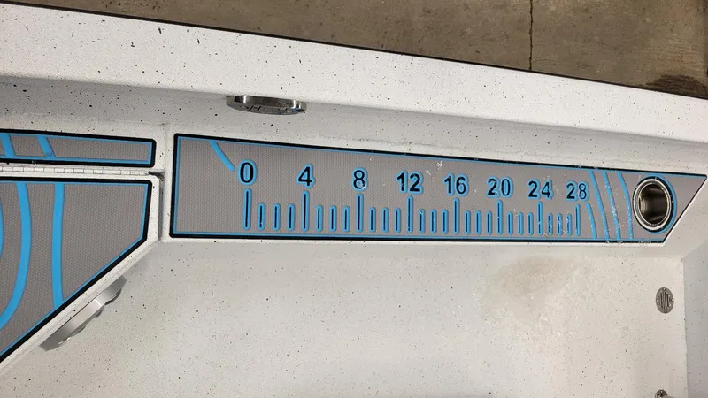 Slide: The Image of 2025 Xpress H20 Bay boat with Yamaha Vmax 150 SHO, featuring a built-in measuring ruler. - 11