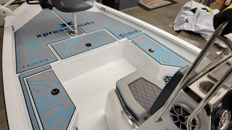 Slide: The Image of 2025 Xpress H20 Bay boat interior with Yamaha Vmax 150 SHO, featuring stylish seating and storage. - 14