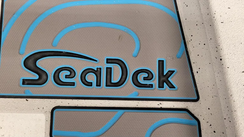 Slide: The Image of SeaDek logo on Xpress H20 Bay boat flooring, 2025 model with Yamaha Vmax 150 SHO. - 16