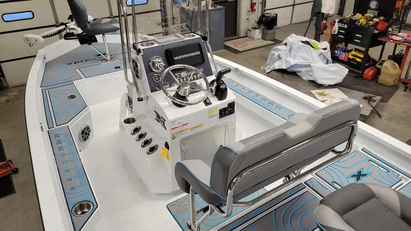 Slide: The Image of 2025 Xpress H20 Bay boat interior with Yamaha Vmax 150 SHO, featuring modern controls. - 6