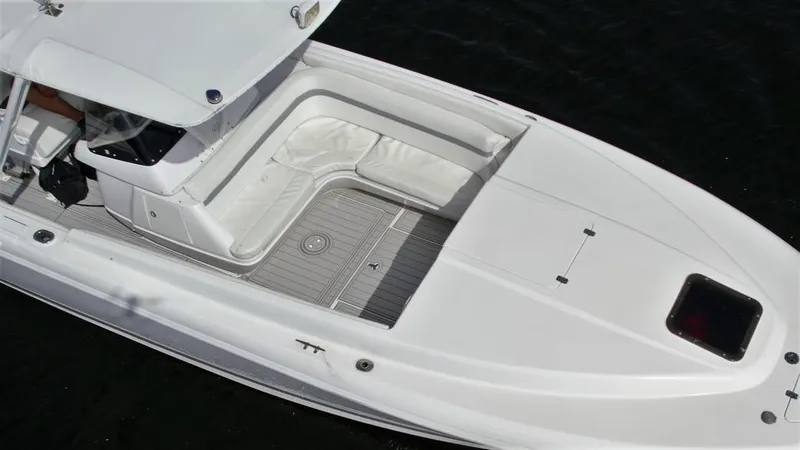 Slide: The Image of 2003 Intrepid 32 boat with white seating and sleek deck design. - 37