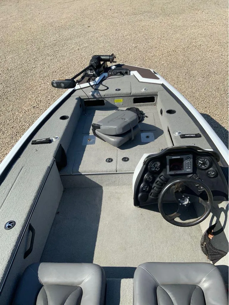 Slide: The Image of 2011 War Eagle Predator 861 boat interior with steering console and seating. - 11
