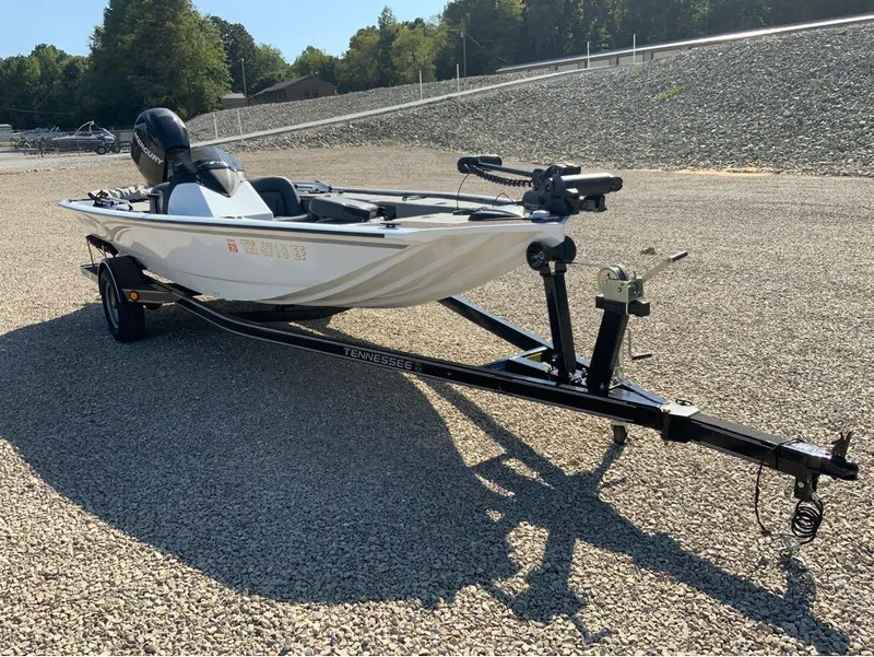 Slide: The Image of 2011 War Eagle Predator 861 boat on trailer, parked on gravel lot. - 4