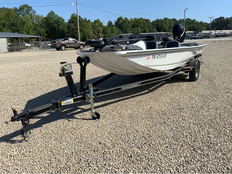 Slide: The Image of 2011 War Eagle Predator 861 boat on trailer in gravel lot. - 6