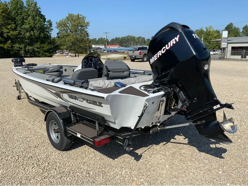 Slide: The Image of 2011 War Eagle Predator 861 boat with Mercury outboard motor on trailer. - 8