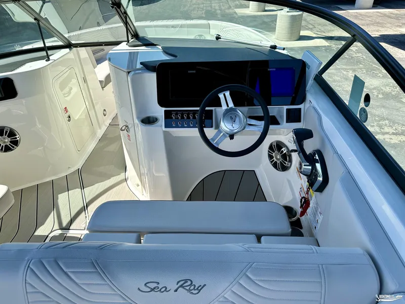 Slide: The Image of 2025 Sea Ray SDX 250 Surf boat cockpit with modern steering and controls. - 11