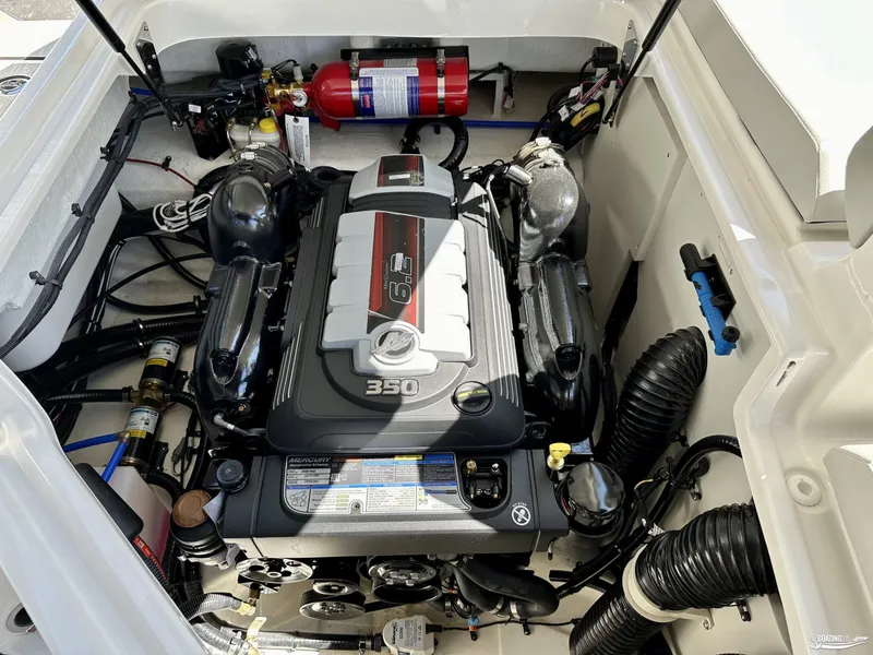 Slide: The Image of Engine compartment of 2025 Sea Ray SDX 250 Surf boat, featuring a 350 horsepower engine. - 15