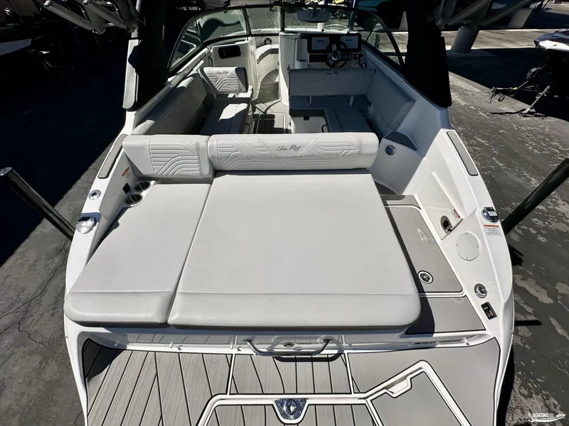 Slide: The Image of 2025 Sea Ray SDX 250 Surf boat interior with sleek seating and modern dashboard. - 9