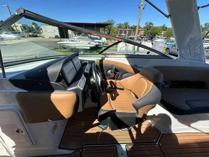 Slide: The Image of Interior of 2025 Crownline 270 SS boat with modern dashboard and seating. - 10