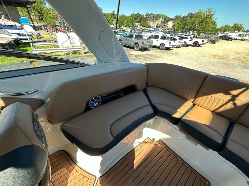 Slide: The Image of Luxurious seating on 2025 Crownline 270 SS boat, featuring tan upholstery and sleek design. - 17