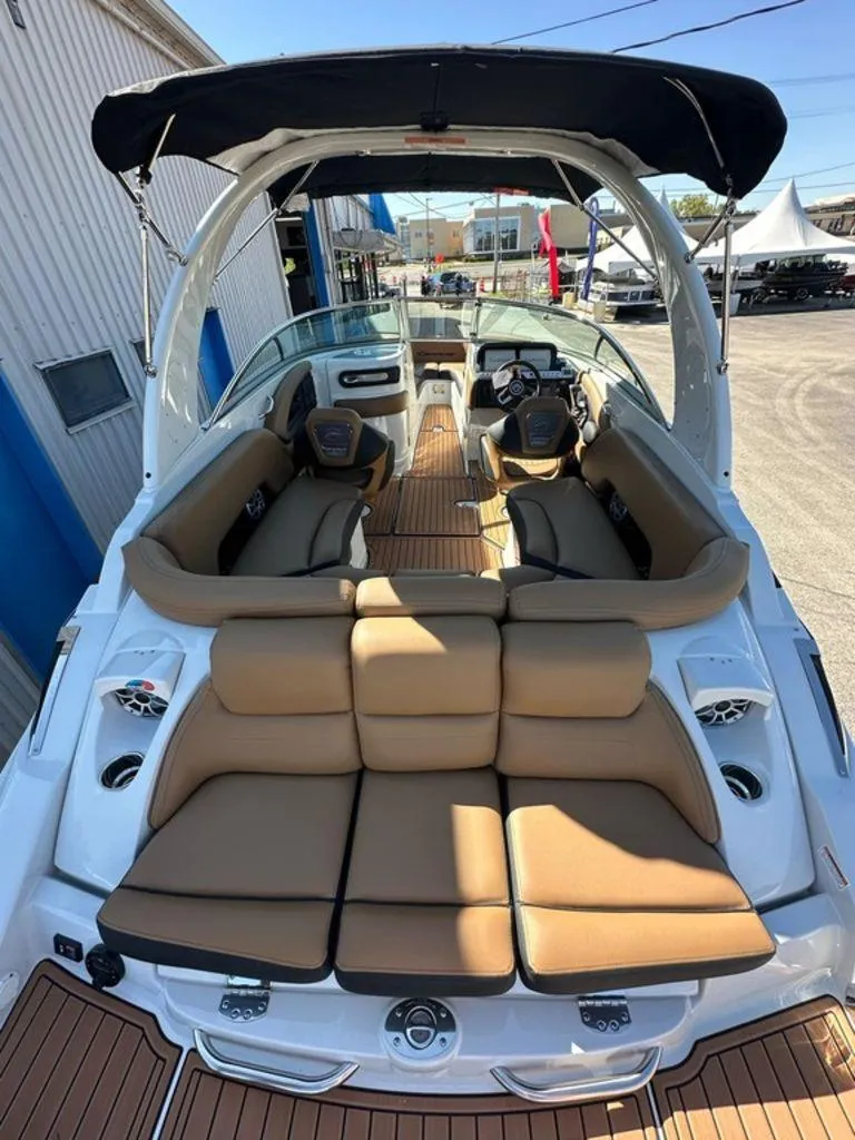 Slide: The Image of 2025 Crownline 270 SS boat interior with tan seating and sleek design. - 2