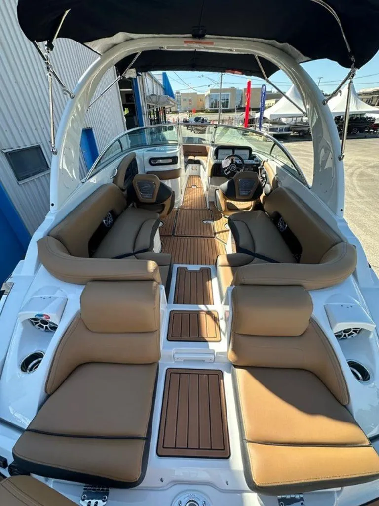 Slide: The Image of 2025 Crownline 270 SS boat interior with tan seating and sleek design. - 3