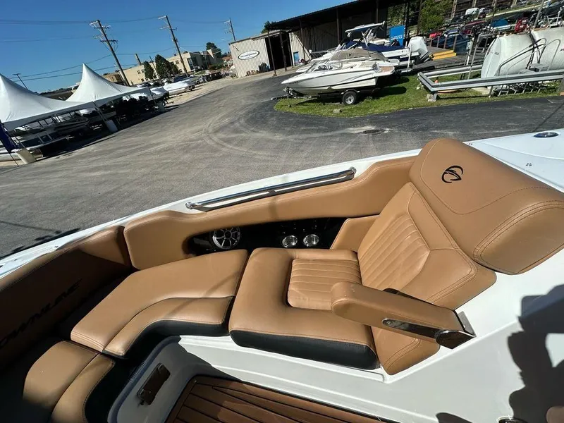 Slide: The Image of 2025 Crownline 270 SS boat interior with tan leather seating and modern design. - 7