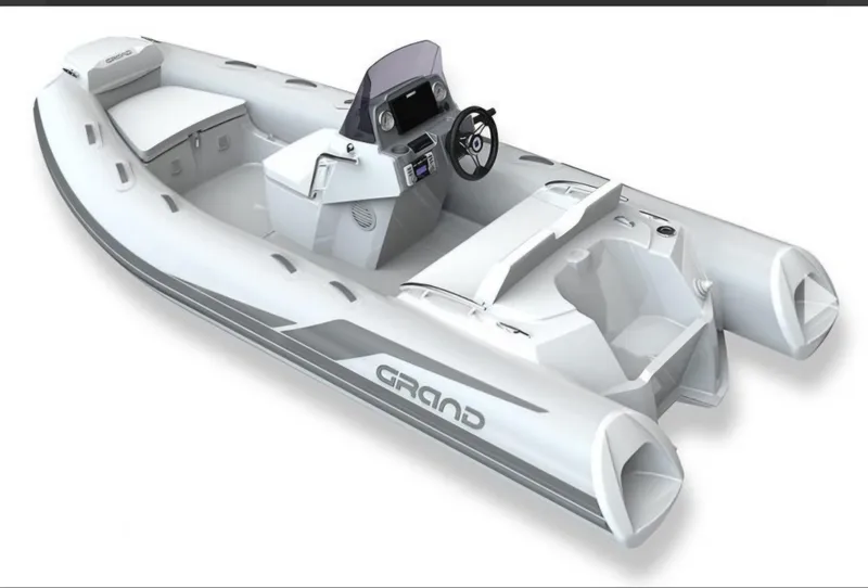 Slide: The Image of 2021 Grand Inflatables G420 boat, sleek design, white with gray accents, modern console. - 6