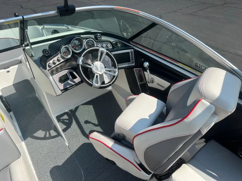 Slide: The Image of Interior of a 2017 MasterCraft XT20 boat with steering console. - 10