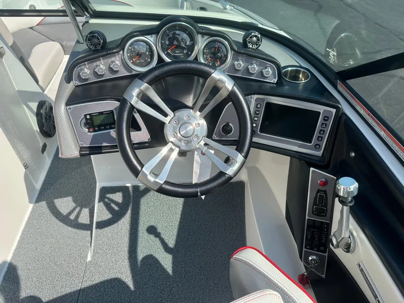 Slide: The Image of Interior view of 2017 MasterCraft XT20 boat cockpit with controls. - 11