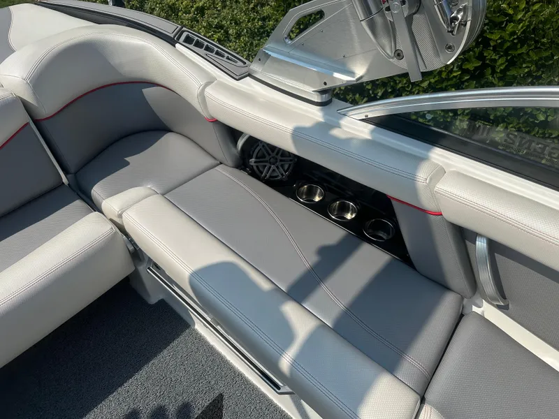 Slide: The Image of Interior of a 2017 MasterCraft XT20 boat with gray upholstery. - 13
