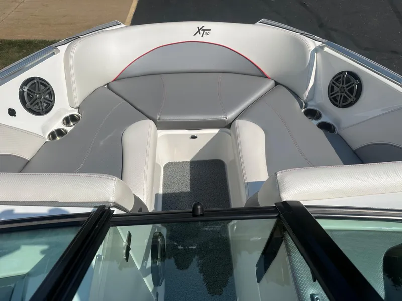 Slide: The Image of Interior of a 2017 MasterCraft XT20 boat with gray upholstery. - 16