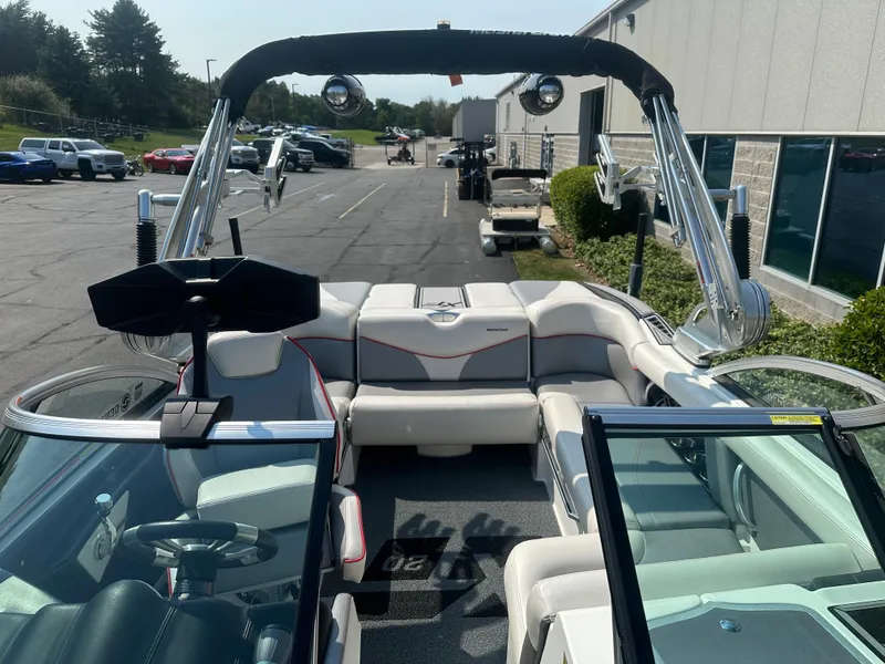 Slide: The Image of Interior of a 2017 MasterCraft XT20 boat on a parking lot. - 17