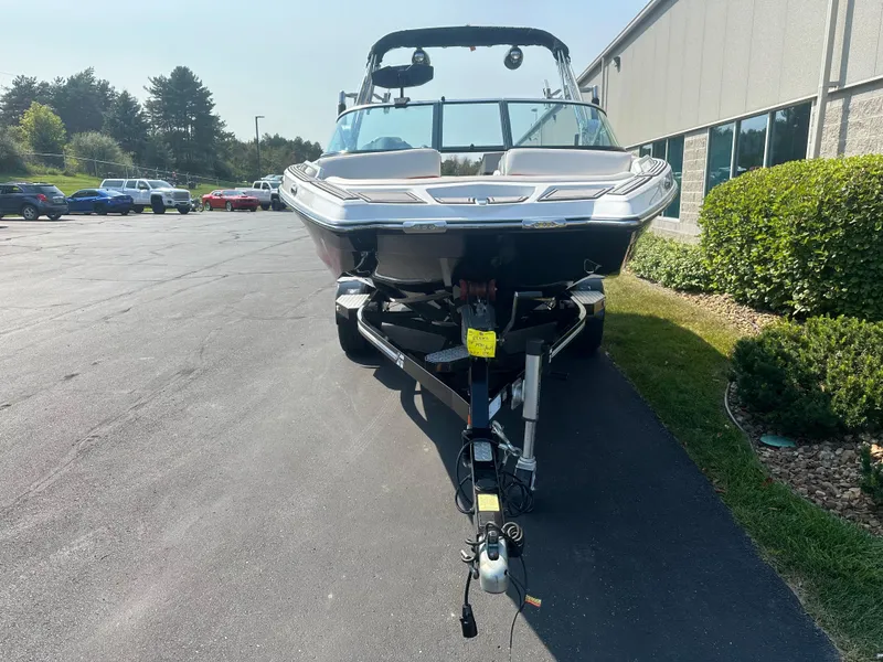 Slide: The Image of 2017 MasterCraft XT20 boat on trailer in front of building. - 3