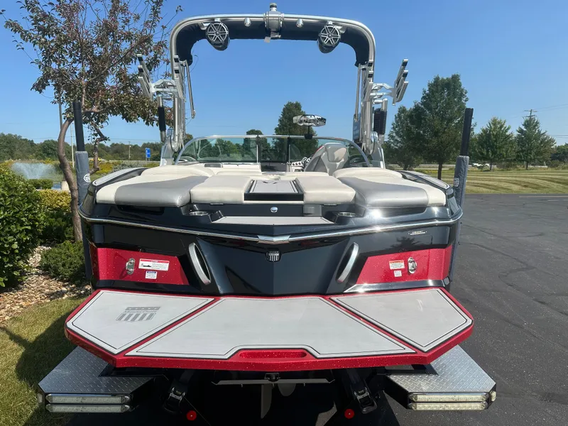 Slide: The Image of Rear view of a 2017 MasterCraft XT20 boat on asphalt. - 6