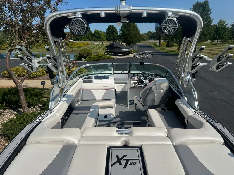Slide: The Image of Interior view of a 2017 MasterCraft XT20 boat with luxurious features. - 8