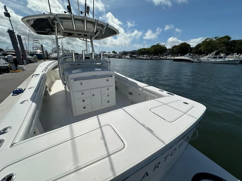 Slide: The Image of 2017 Regulator 31 boat docked at marina under clear sky. - 10
