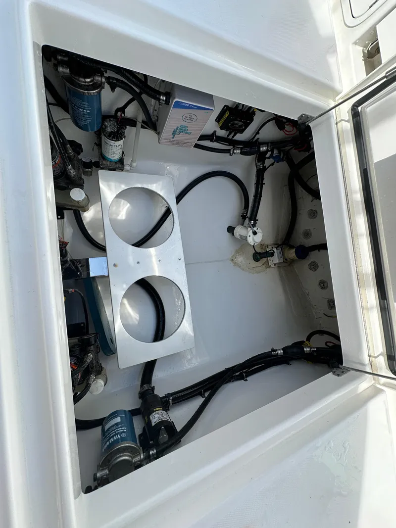 Slide: The Image of 2017 Regulator 31 boat compartment with wiring and components. - 16