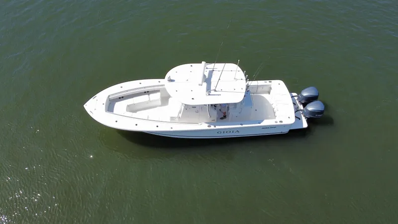 Slide: The Image of Aerial view of 2017 Regulator 31 boat on calm water. - 24