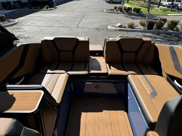 Slide: The Image of 2024 Yamaha Boats 255XD interior with luxurious brown seating and sleek design. - 8