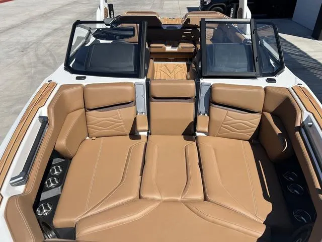Slide: The Image of 2025 Supra SA 450 boat interior with tan leather seating and modern design. - 11