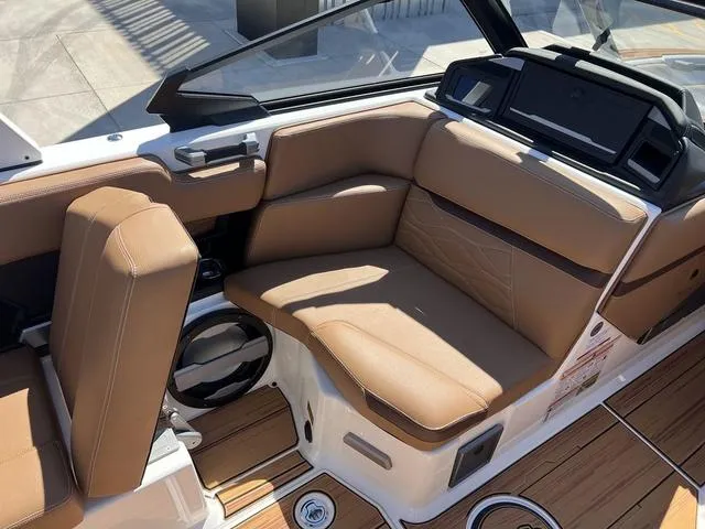 Slide: The Image of Luxurious interior of 2025 Supra SA 450 boat with tan leather seating. - 13