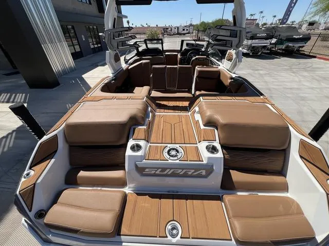 Slide: The Image of 2025 Supra SA 450 boat interior with luxurious brown seating and modern design. - 17