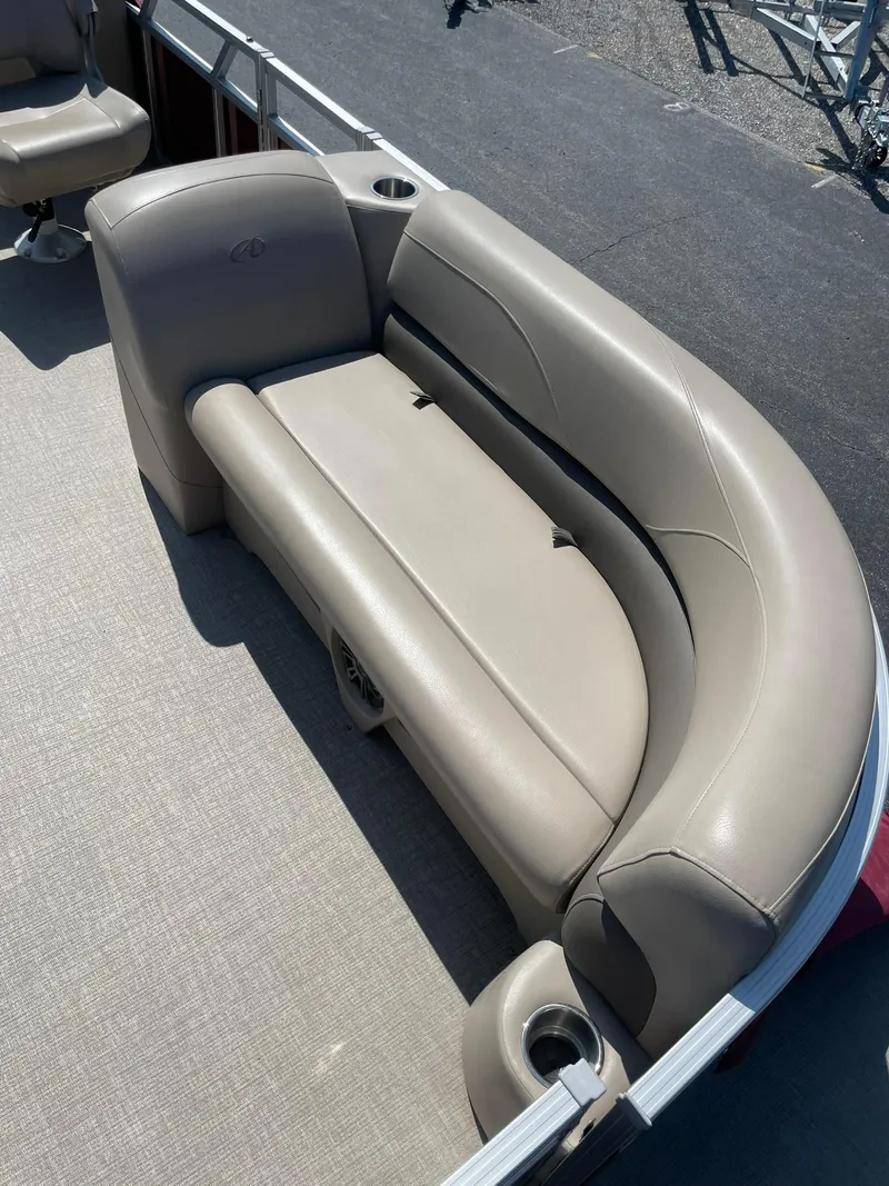 Slide: The Image of 2021 Avalon GS Cruise 23' boat with beige seating and cup holders. - 12