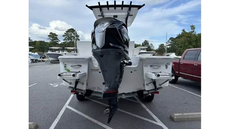 Slide: The Image of 2025 Sea Fox 251 Bay Fox boat with outboard motor in parking lot. - 3