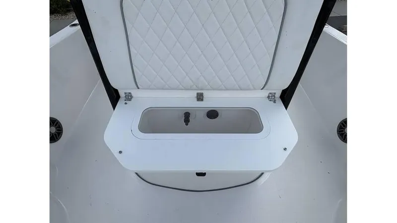 Slide: The Image of 2025 Sea Fox 251 Bay Fox boat storage compartment with quilted lid design. - 9