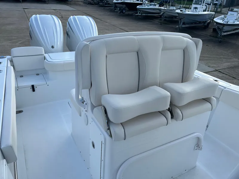 Slide: The Image of 2024 Sea Hunt Gamefish 27 FS boat interior with dual seats and twin engines. - 14