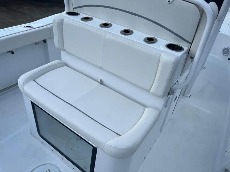 Slide: The Image of 2024 Sea Hunt Gamefish 27 FS boat seating with cup holders and storage. - 9