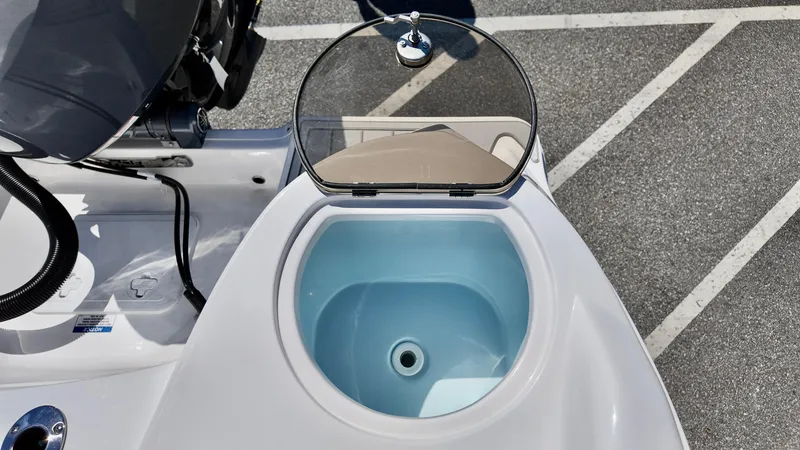 Slide: The Image of 2025 Sea Fox 228 Traveler boat livewell with open lid, showcasing interior. - 13