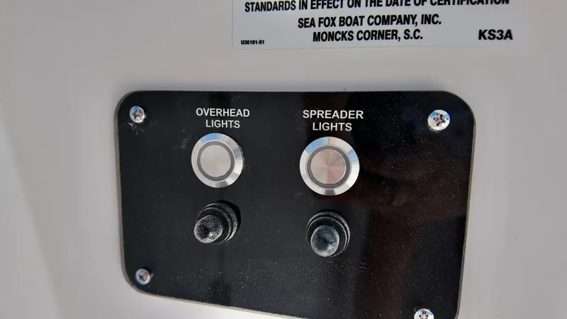 Slide: The Image of Control panel of 2025 Sea Fox 228 Traveler with overhead and spreader light switches. - 15