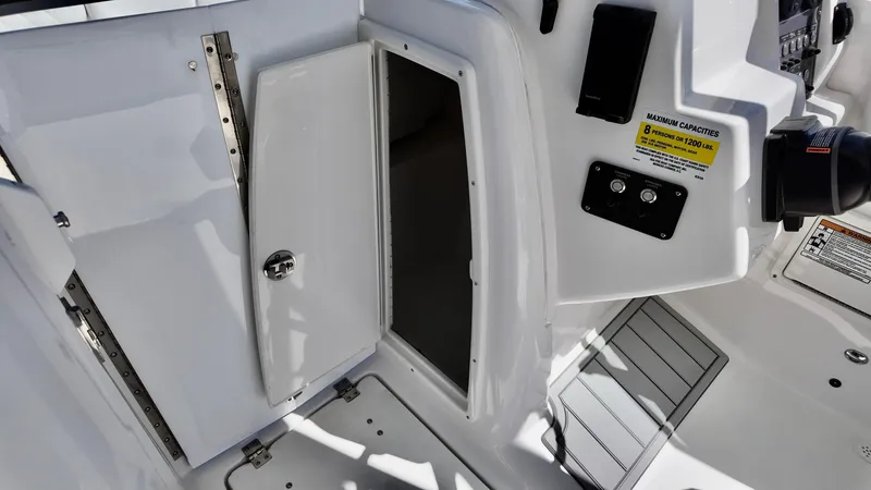 Slide: The Image of 2025 Sea Fox 228 Traveler boat interior with open storage compartment. - 17