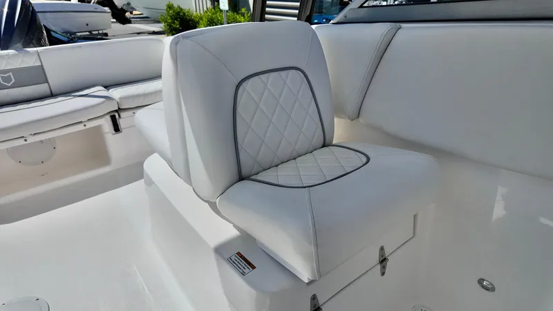 Slide: The Image of 2025 Sea Fox 228 Traveler boat seat with white quilted upholstery. - 20