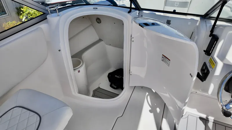Slide: The Image of 2025 Sea Fox 228 Traveler boat interior with open storage compartment. - 22