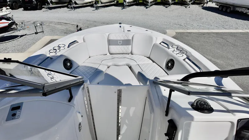 Slide: The Image of 2025 Sea Fox 228 Traveler boat interior with white seating and cup holders. - 24