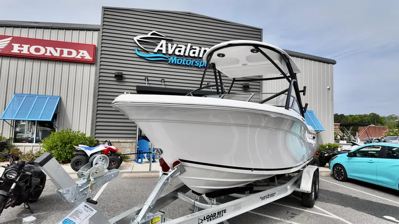 Slide: The Image of 2025 Sea Fox 228 Traveler boat on trailer at Avalanche Motorsports dealership. - 5