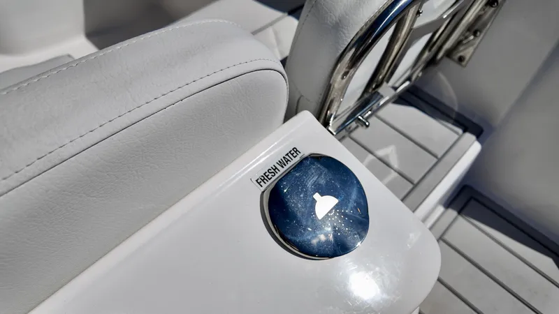 Slide: The Image of Freshwater access on 2025 Sea Fox 228 Traveler boat, featuring sleek white seating. - 8