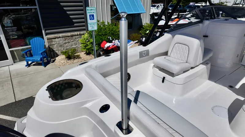 Slide: The Image of 2025 Sea Fox 228 Traveler boat interior with seating and fishing rod holder. - 9