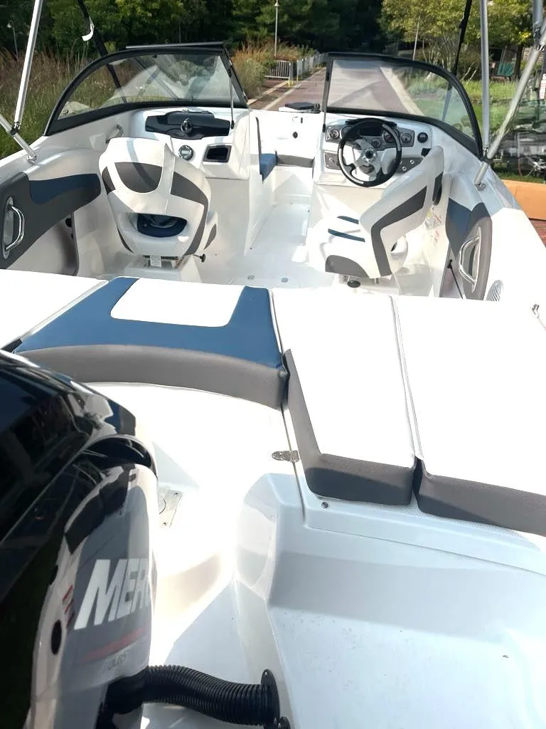 Slide: The Image of 2024 Tahoe 200 S boat interior with modern seating and steering wheel. - 3